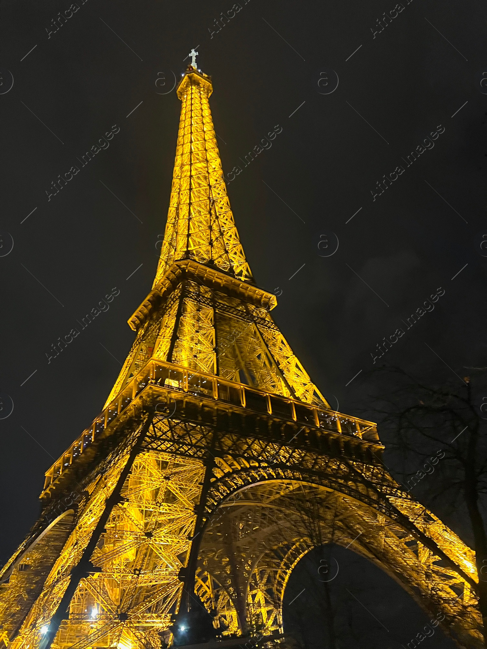 Photo of Beautiful illuminated Eiffel tower against night sky, low angle view