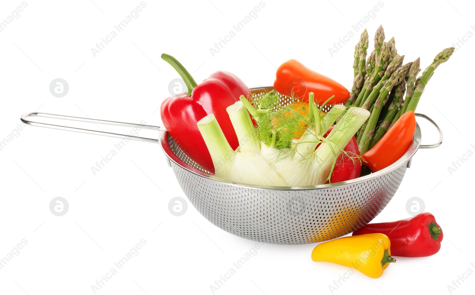 Photo of Metal colander with different vegetables isolated on white