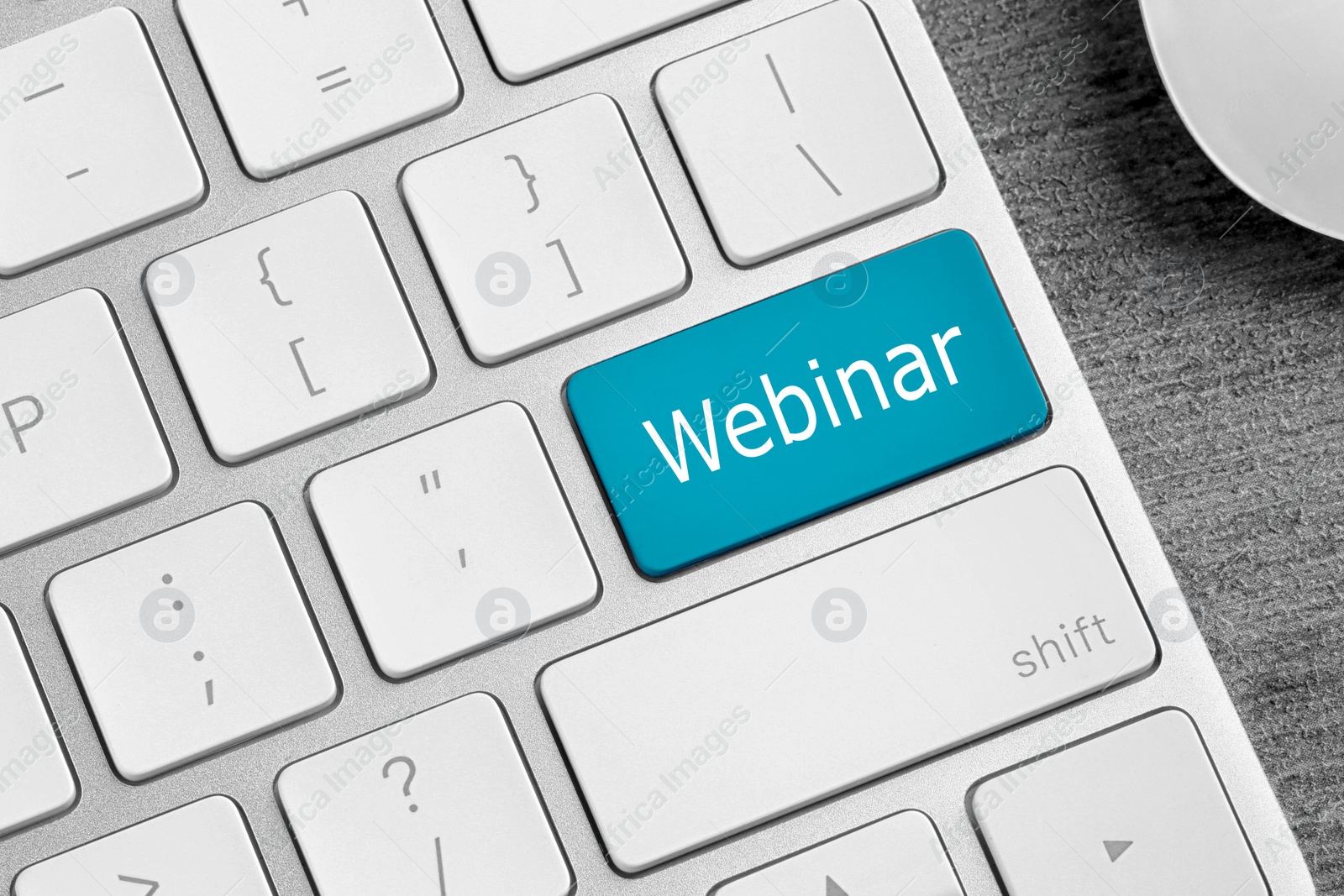 Image of Online learning. Blue button with word Webinar on computer keyboard, closeup