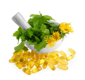 Mortar with fresh green herbs and pills on white background, top view