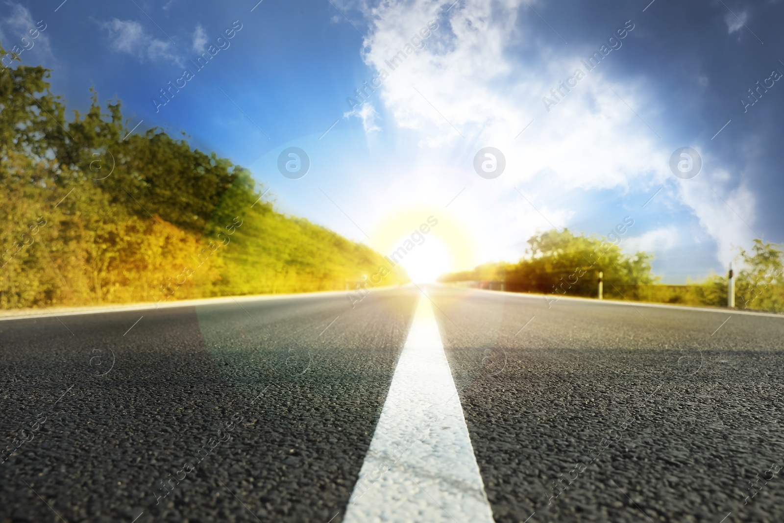 Image of Empty asphalt road under beautiful blue sky