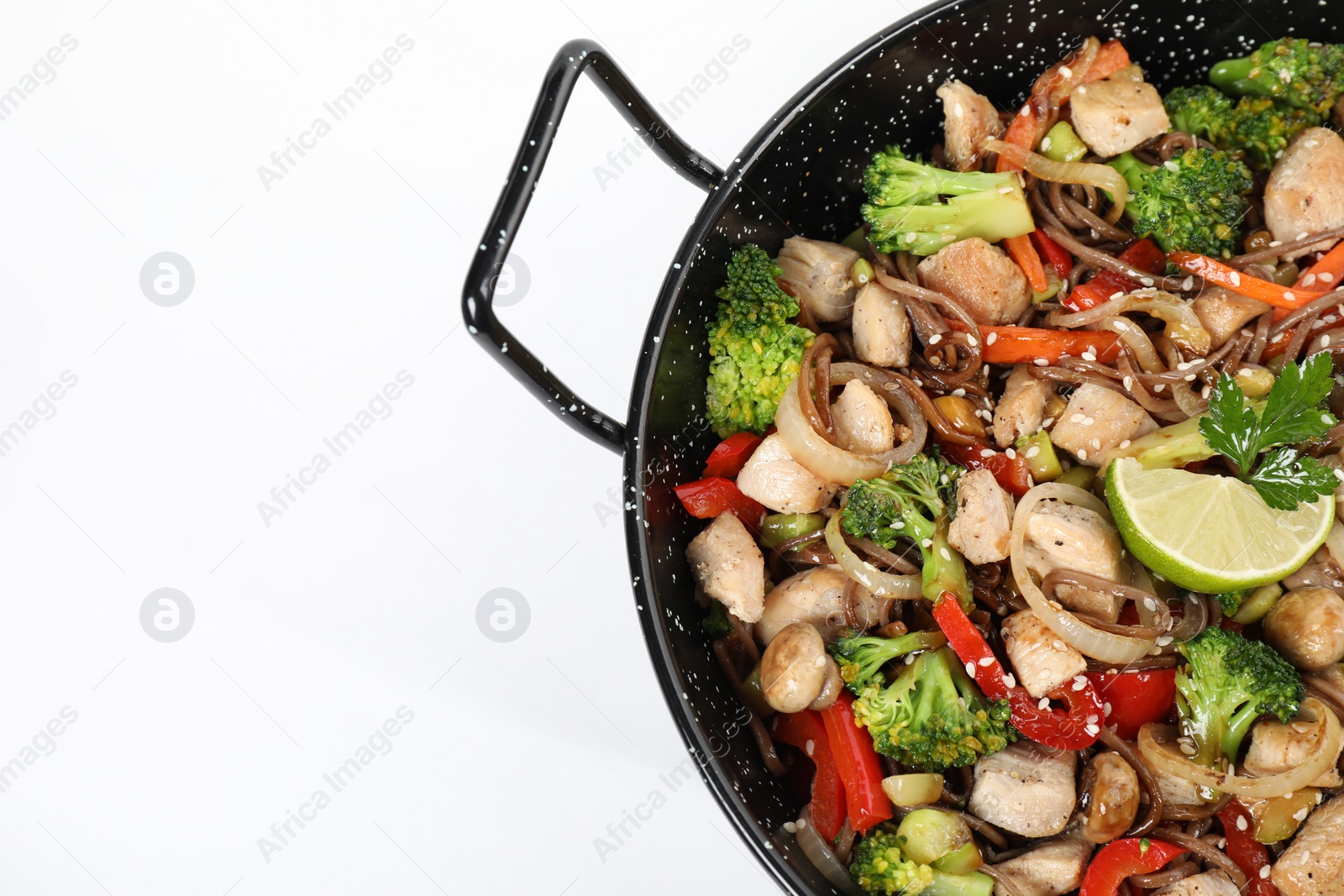 Photo of Stir-fry. Tasty noodles with meat and vegetables in wok on white background, top view. Space for text