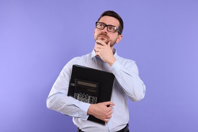 Photo of Thoughtful accountant with calculator on violet background. Space for text