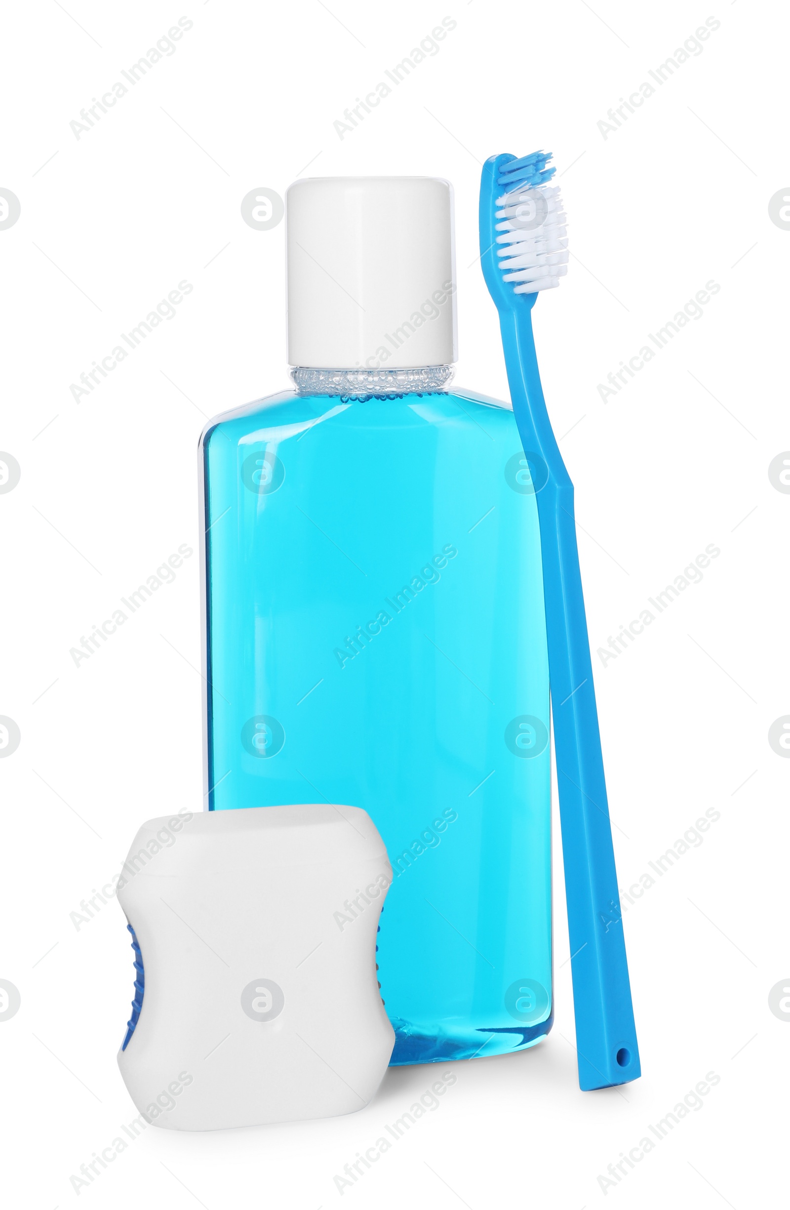 Photo of Mouthwash, toothbrush and dental floss isolated on white