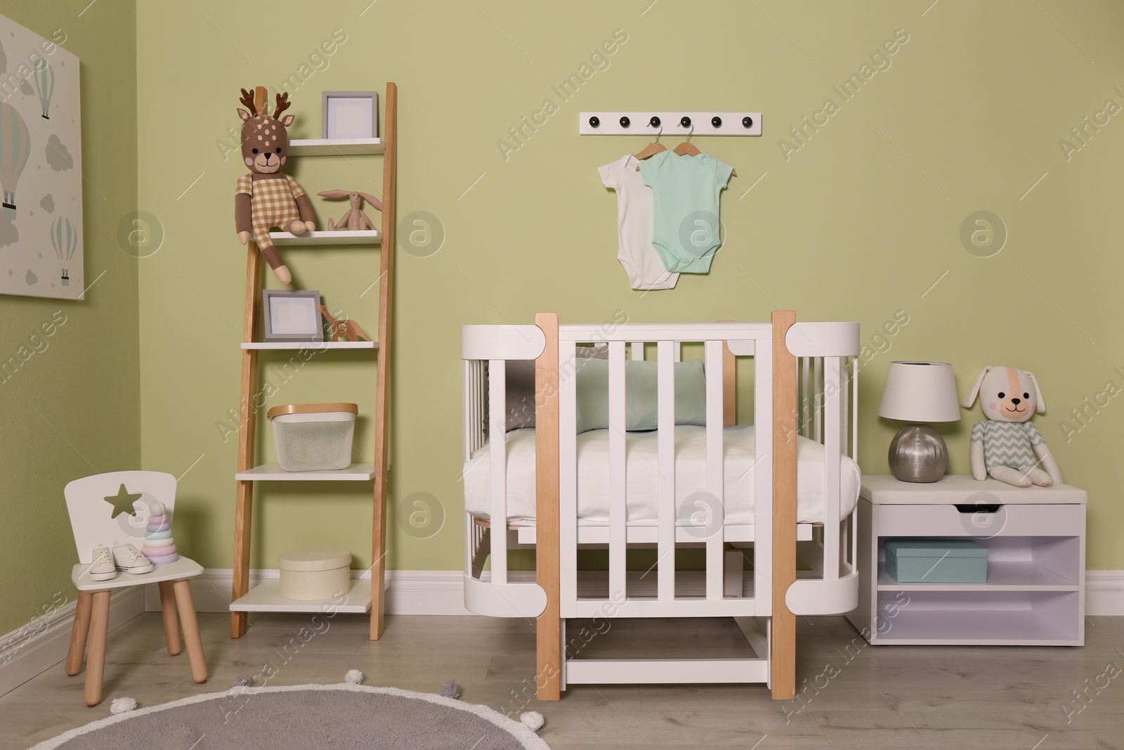 Photo of Baby room interior with stylish wooden furniture