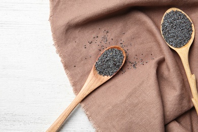 Photo of Flat lay composition with poppy seeds on wooden background