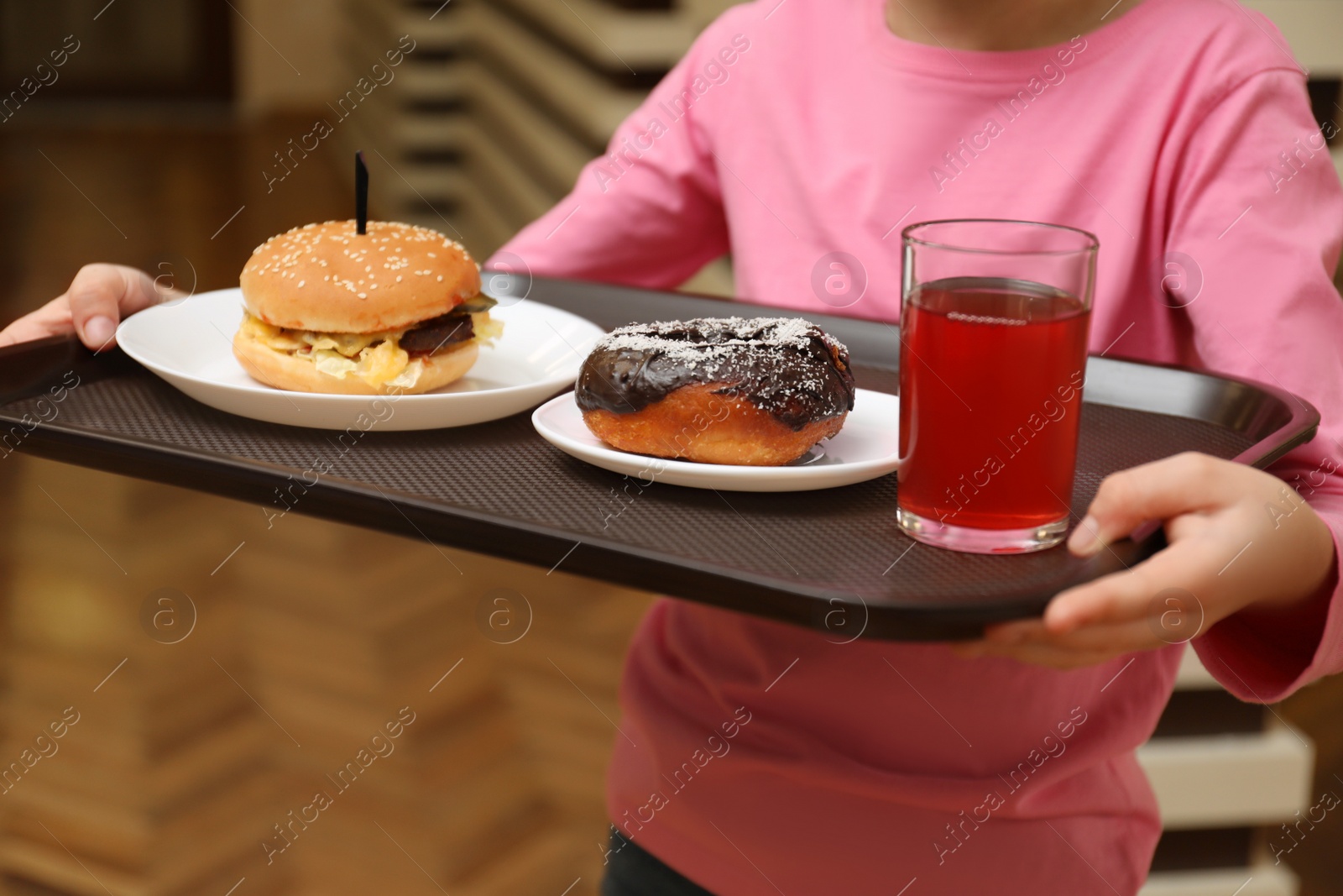 Photo of Little girl with tasty food in school canteen, closeup