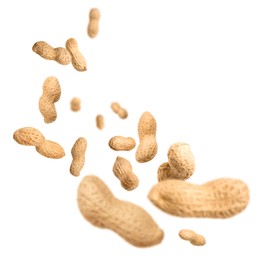 Image of Unpeeled peanuts in air on white background