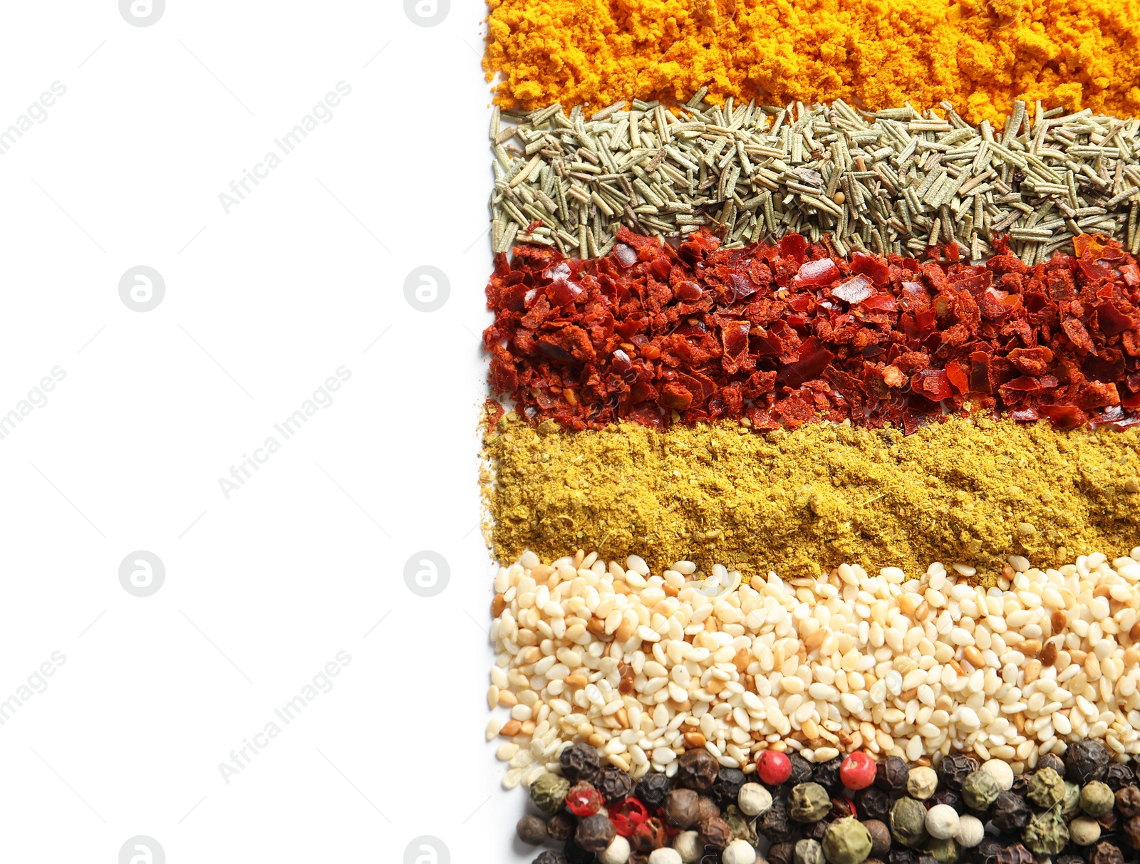 Photo of Rows of different aromatic spices on white background, top view with space for text