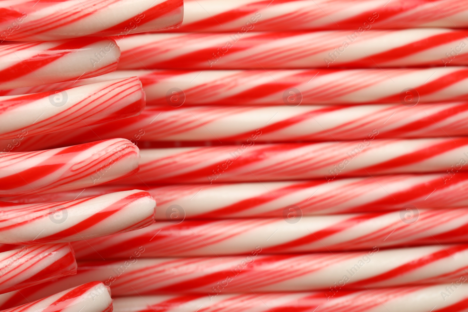 Photo of Many candy canes as background. Festive treat