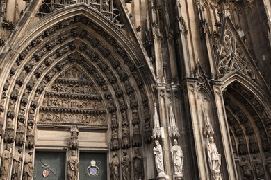 Photo of Cologne, Germany - August 28, 2022: Entrance of beautiful gothic cathedral outdoors