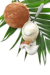 Photo of Beautiful composition with coconut oil and nuts on white background