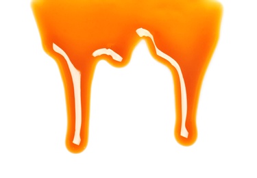 Delicious caramel sauce on white background