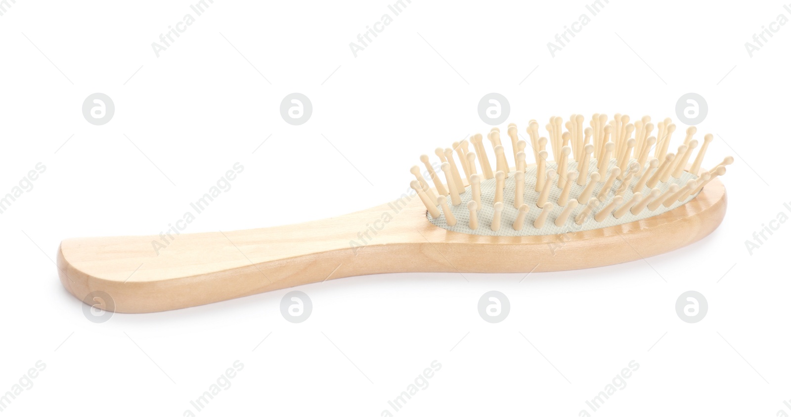 Photo of New wooden hair brush isolated on white