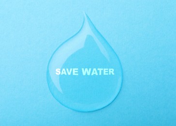 Save Water concept. Drop on light blue background