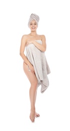 Photo of Full length portrait of young pretty woman with towels on white background