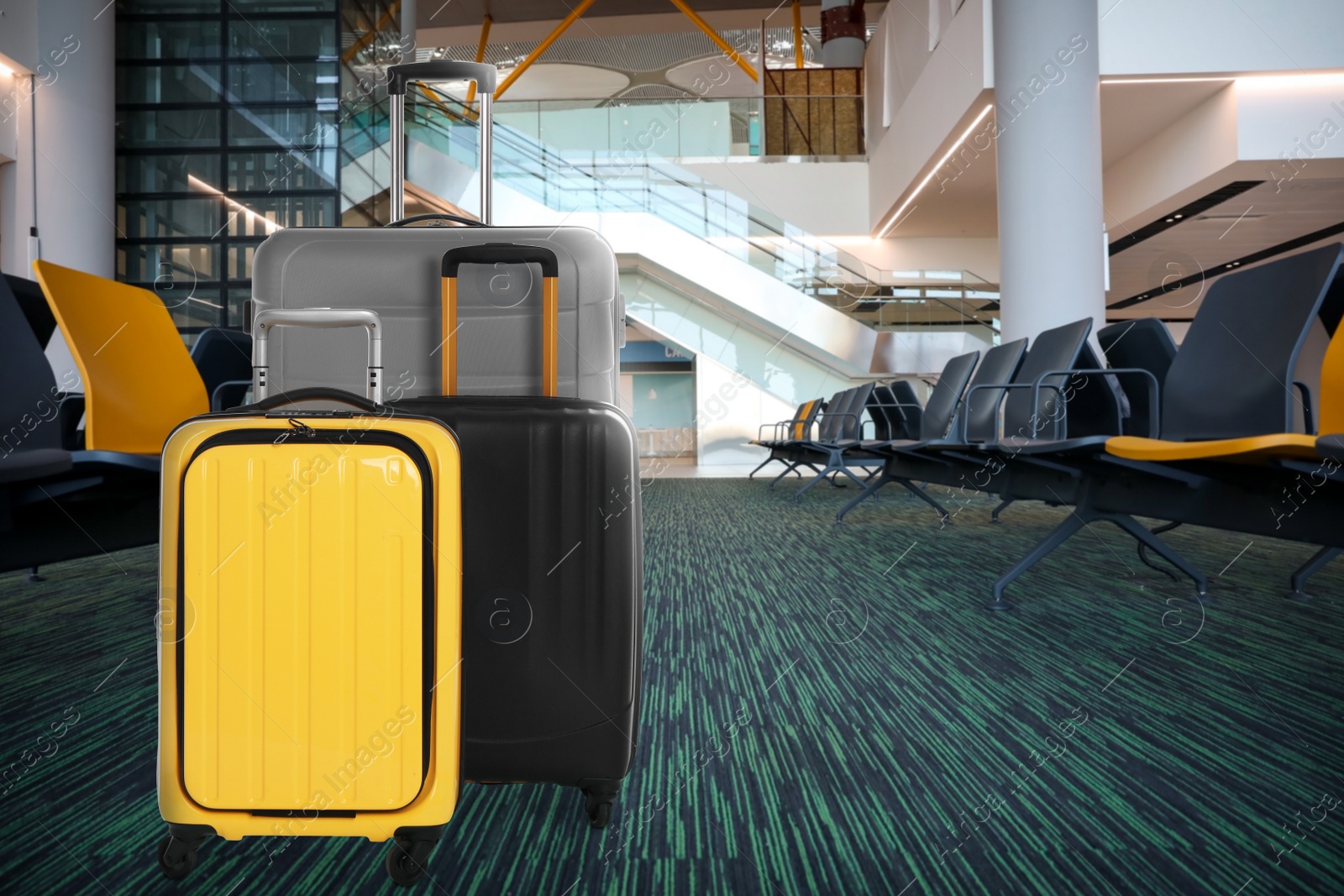 Image of Stylish suitcases in waiting area at airport terminal