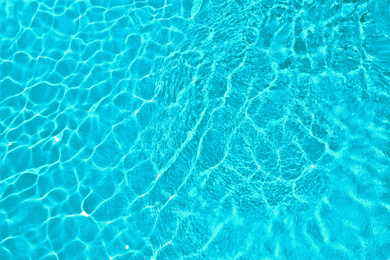 Image of Swimming pool with clean water as background. Summer vacation