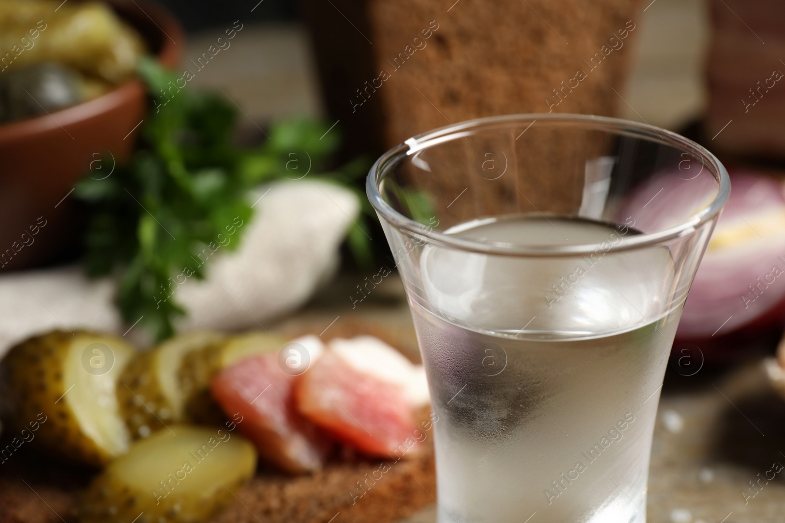 Photo of Cold Russian vodka on table, closeup. Space for text