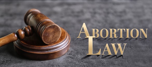Image of Abortion law. Judge's gavel on grey background. Banner design