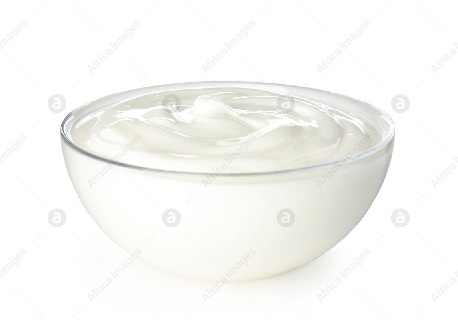 Photo of Glass bowl with creamy yogurt on white background