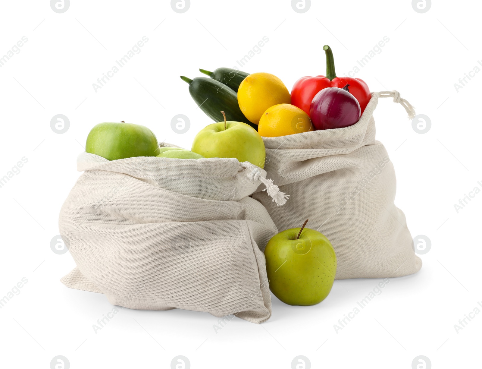 Photo of Cotton eco bags with fruits and vegetables isolated on white