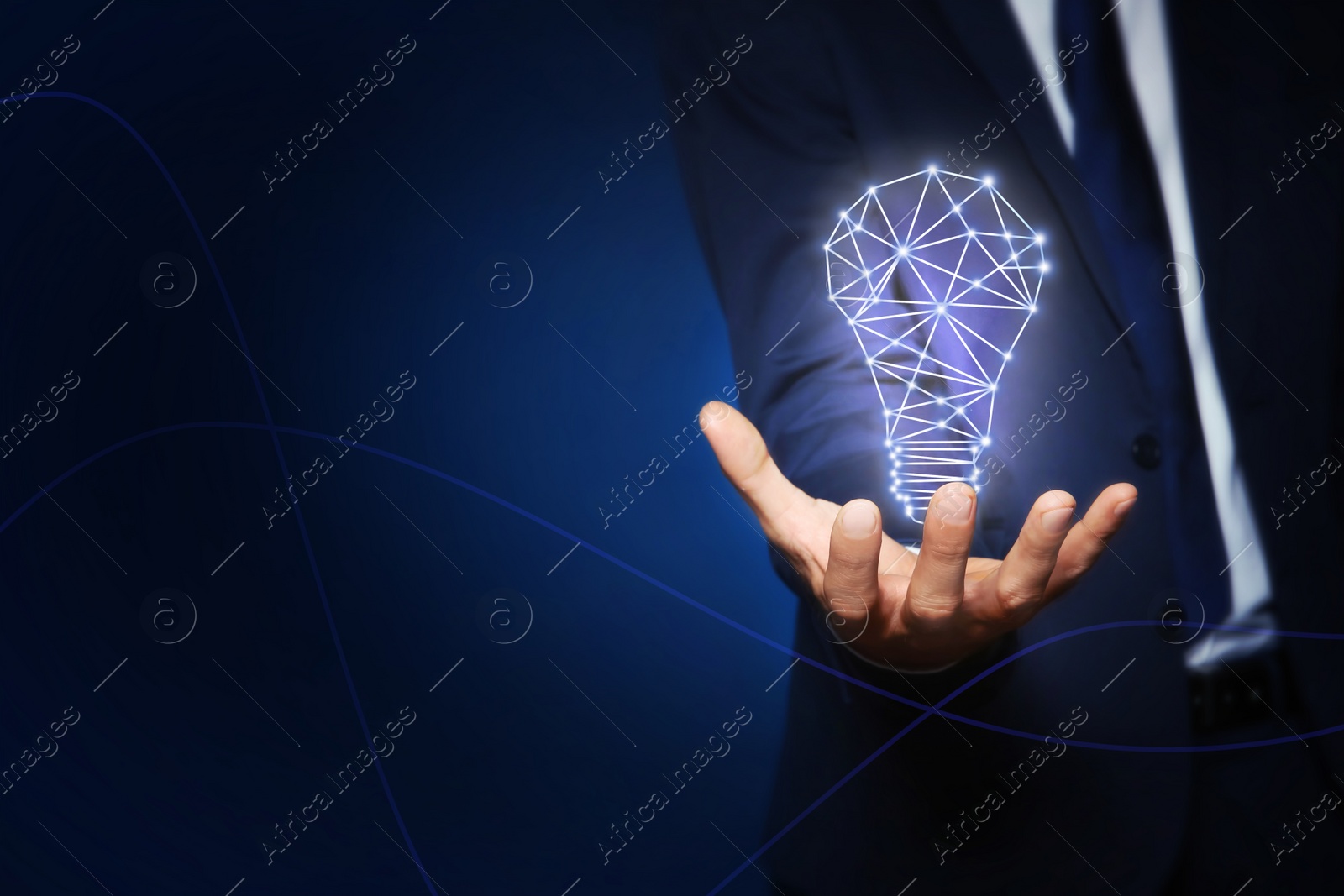 Image of Idea concept. Businessman demonstrating glowing light bulb illustration on dark background, closeup. Space for text