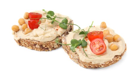 Delicious sandwiches with hummus , tomato slices and chickpeas on white background