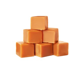 Heap of caramel candies on white background