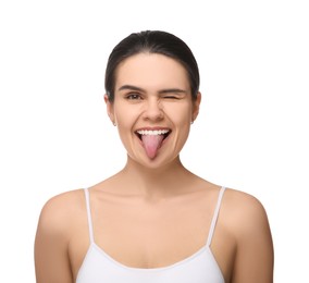 Photo of Happy young woman showing her tongue on white background