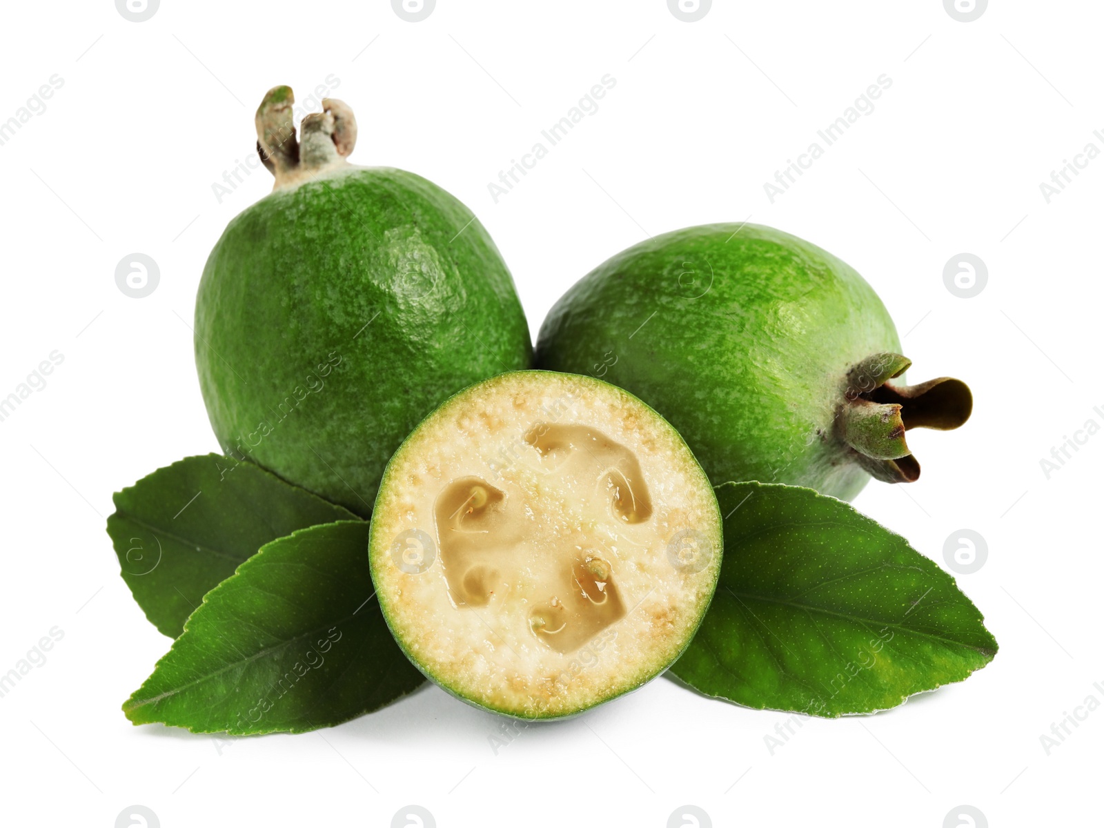 Photo of Whole and cut feijoa fruits on white background