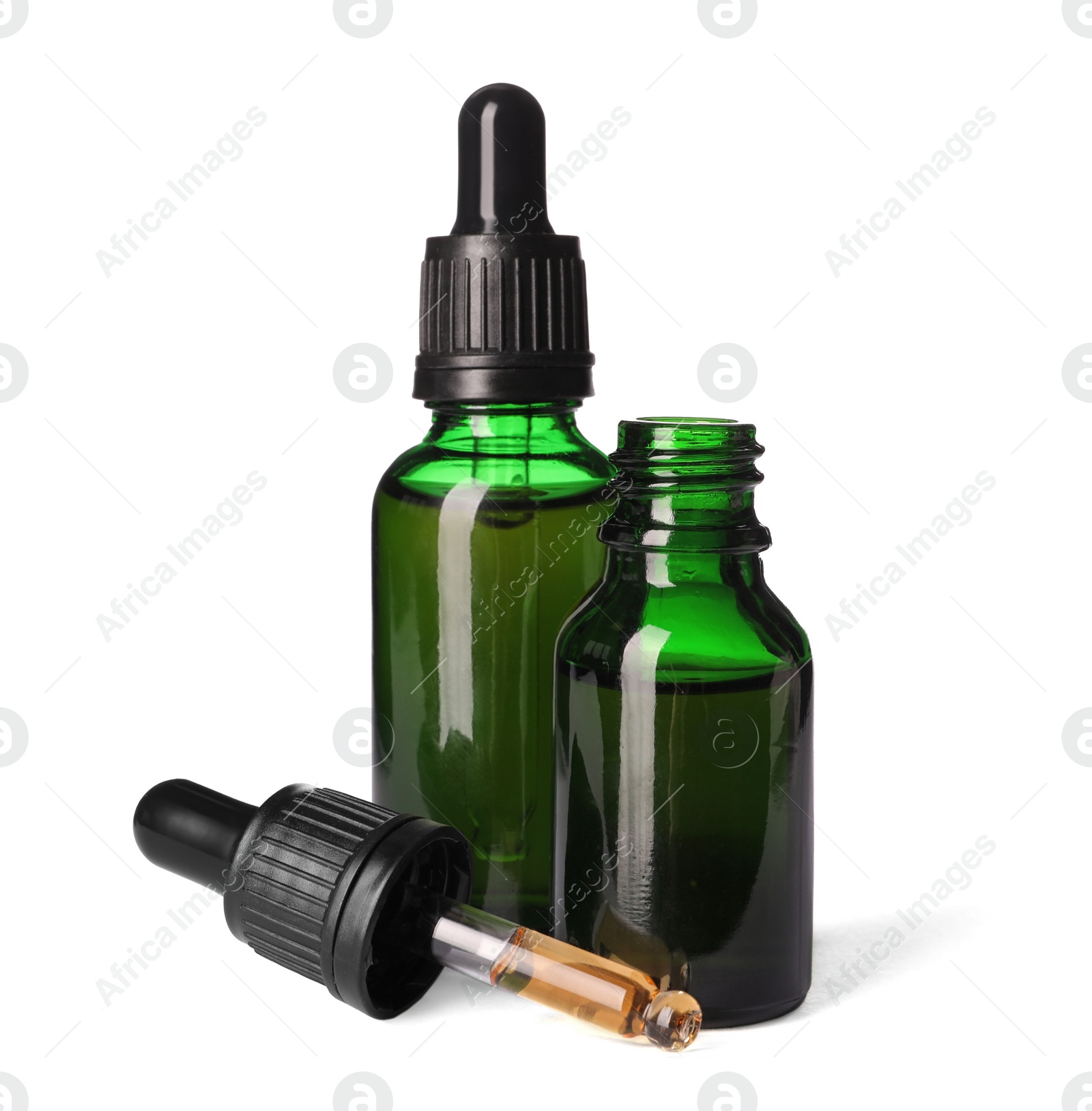 Photo of Cosmetic bottles of essential oils on white background