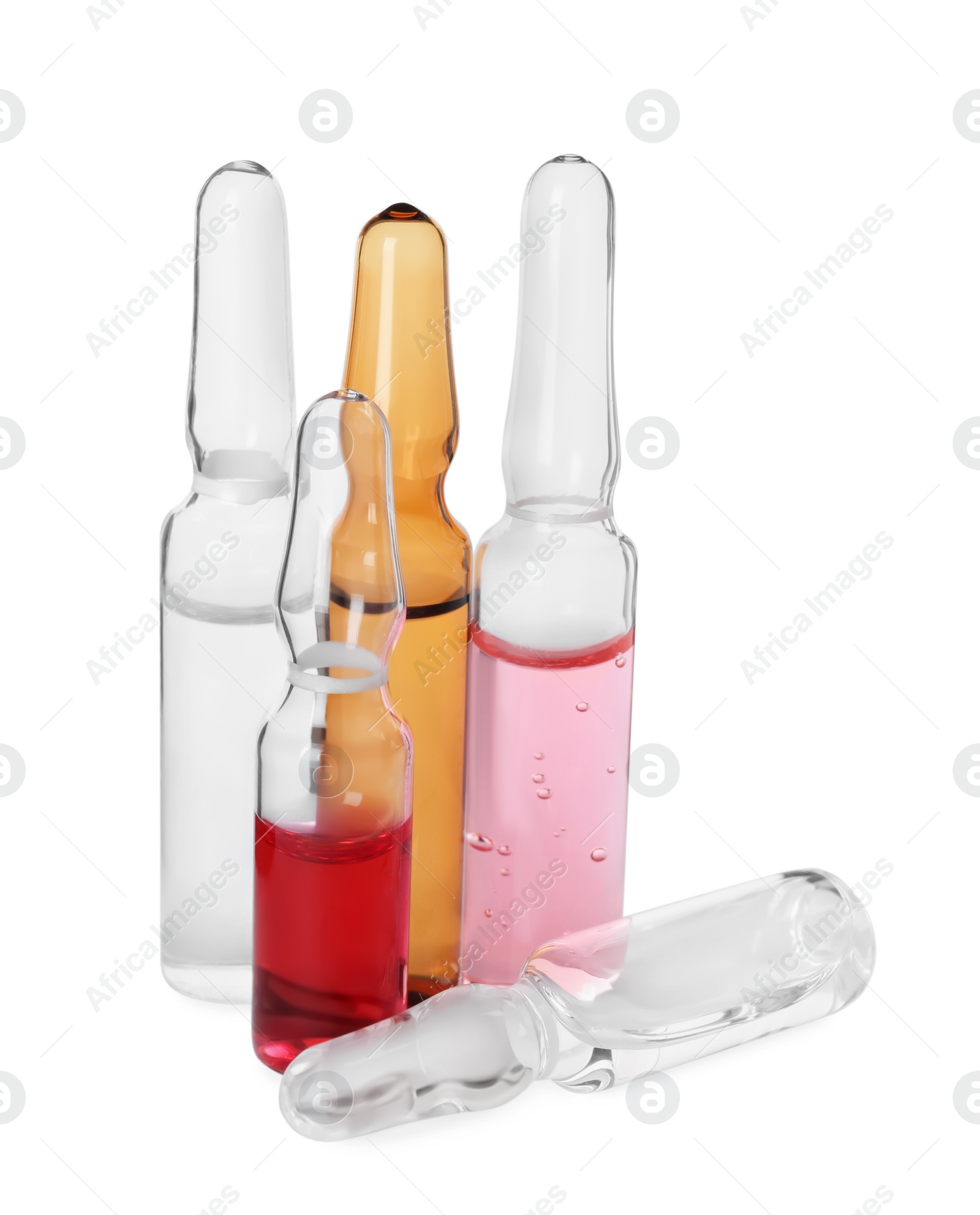 Photo of Glass ampoules with pharmaceutical products on white background