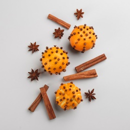 Photo of Flat lay composition with pomander balls made of fresh tangerines on light grey background