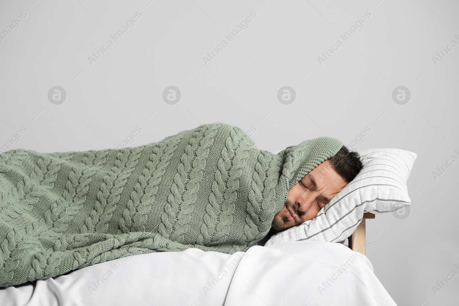 Photo of Tired man sleeping in bed at home