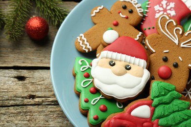 Different tasty Christmas cookies on wooden table, above view. Space for text