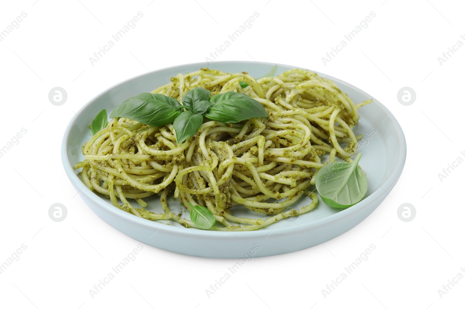 Photo of Plate of delicious pasta with pesto sauce and basil isolated on white