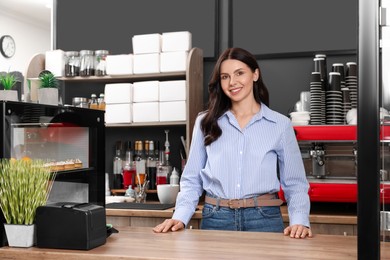Photo of Business owner at desk in her cafe