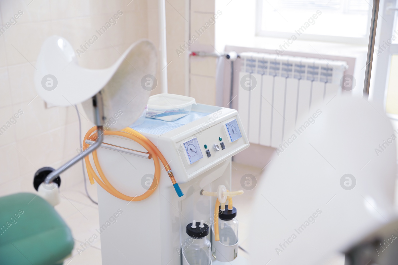 Photo of Examination room with medical aspirator for artificial abortion in clinic. Gynecological checkup