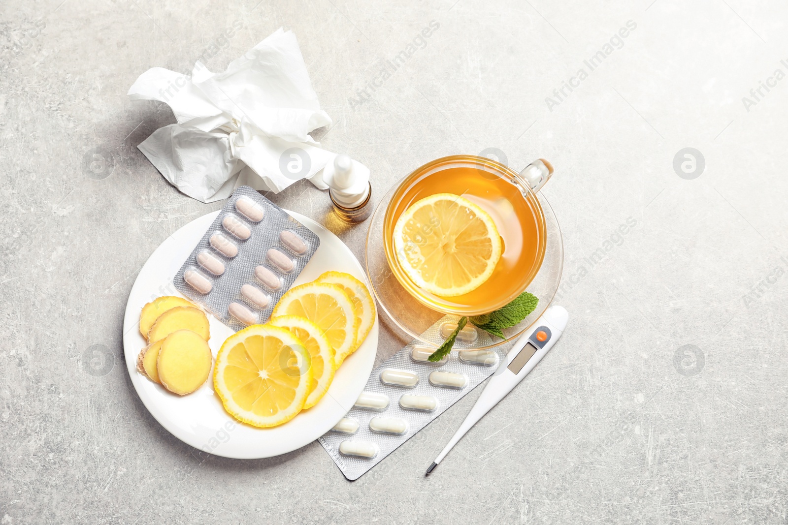 Photo of Natural and medical cold remedies on table, top view