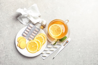 Photo of Natural and medical cold remedies on table, top view