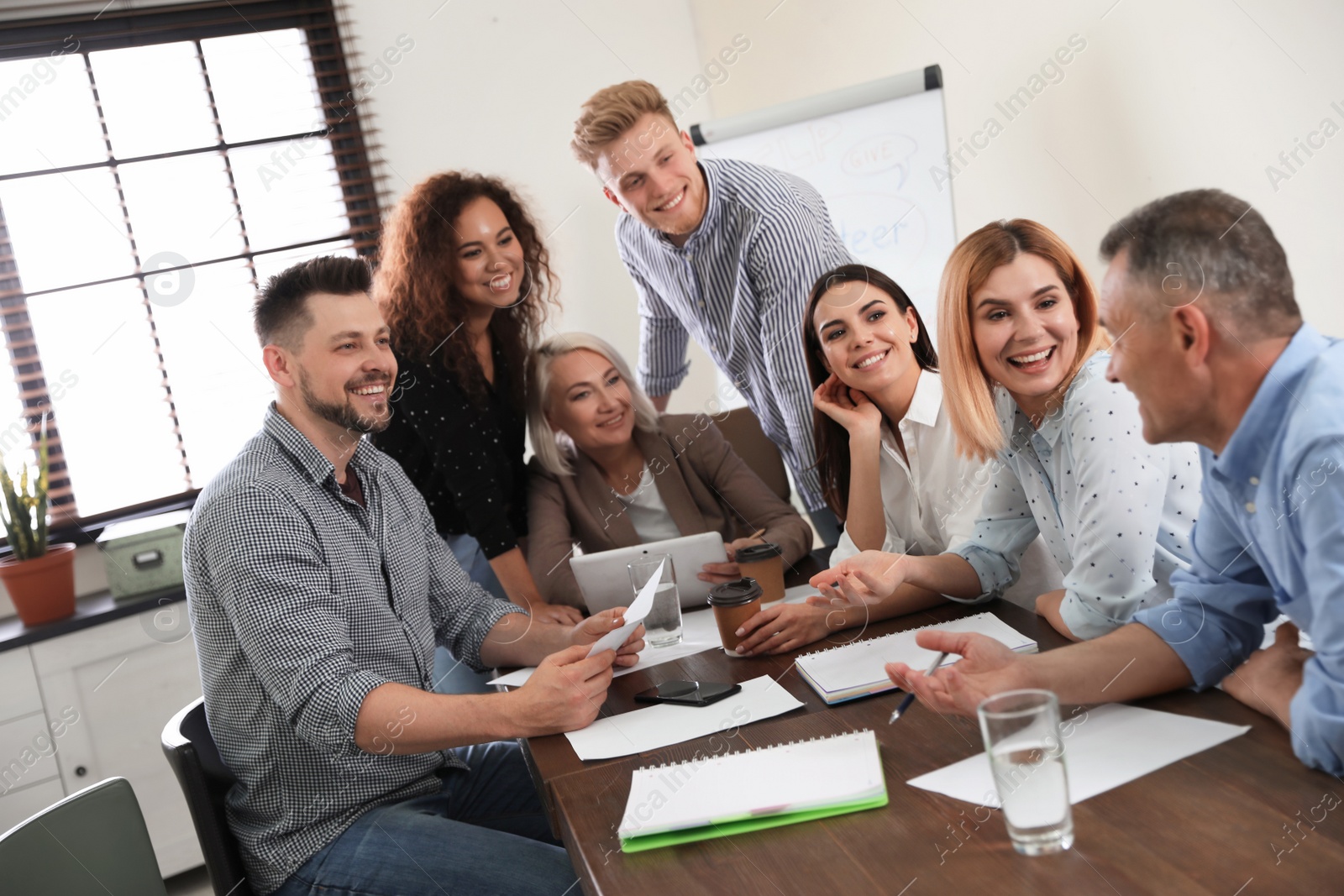 Photo of Portrait of volunteers having meeting in office