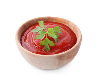 Tasty tomato sauce with parsley in wooden bowl isolated on white