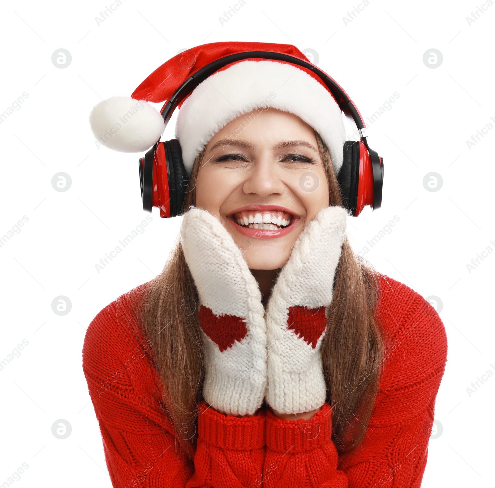 Photo of Young woman in Santa hat listening to Christmas music on white background