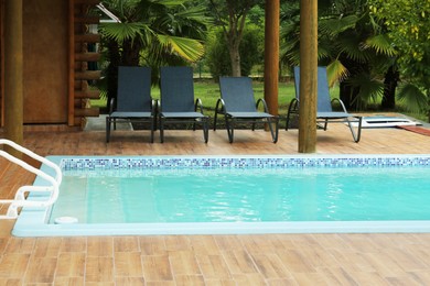 Photo of Outdoor swimming pool with clear water at resort