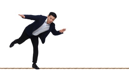 Image of Risks and challenges of owning business. Man balancing on rope against white background, banner design