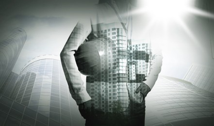 Image of Engineer with hard hat and cityscapes, multiple exposure. Banner design with black and white effect