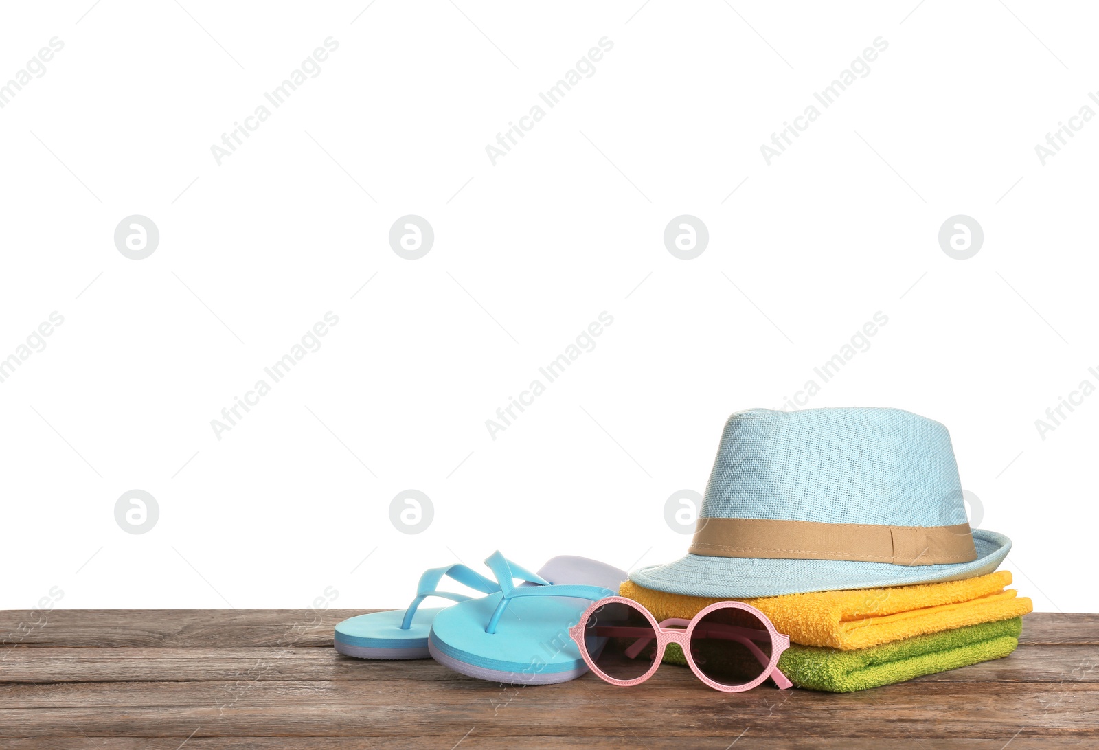 Photo of Set of different beach accessories on table against white background. Space for text