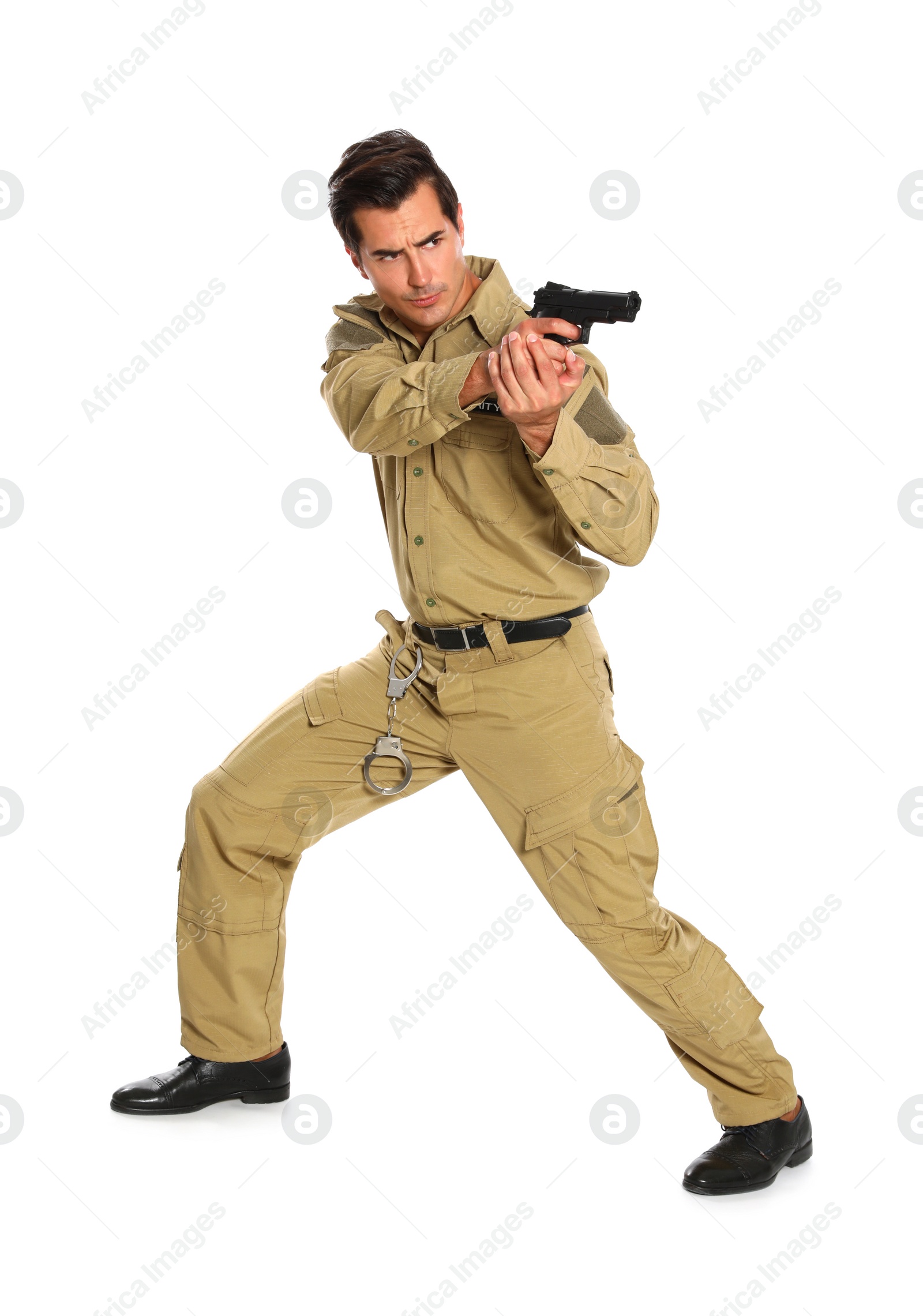 Photo of Male security guard in uniform with gun on white background