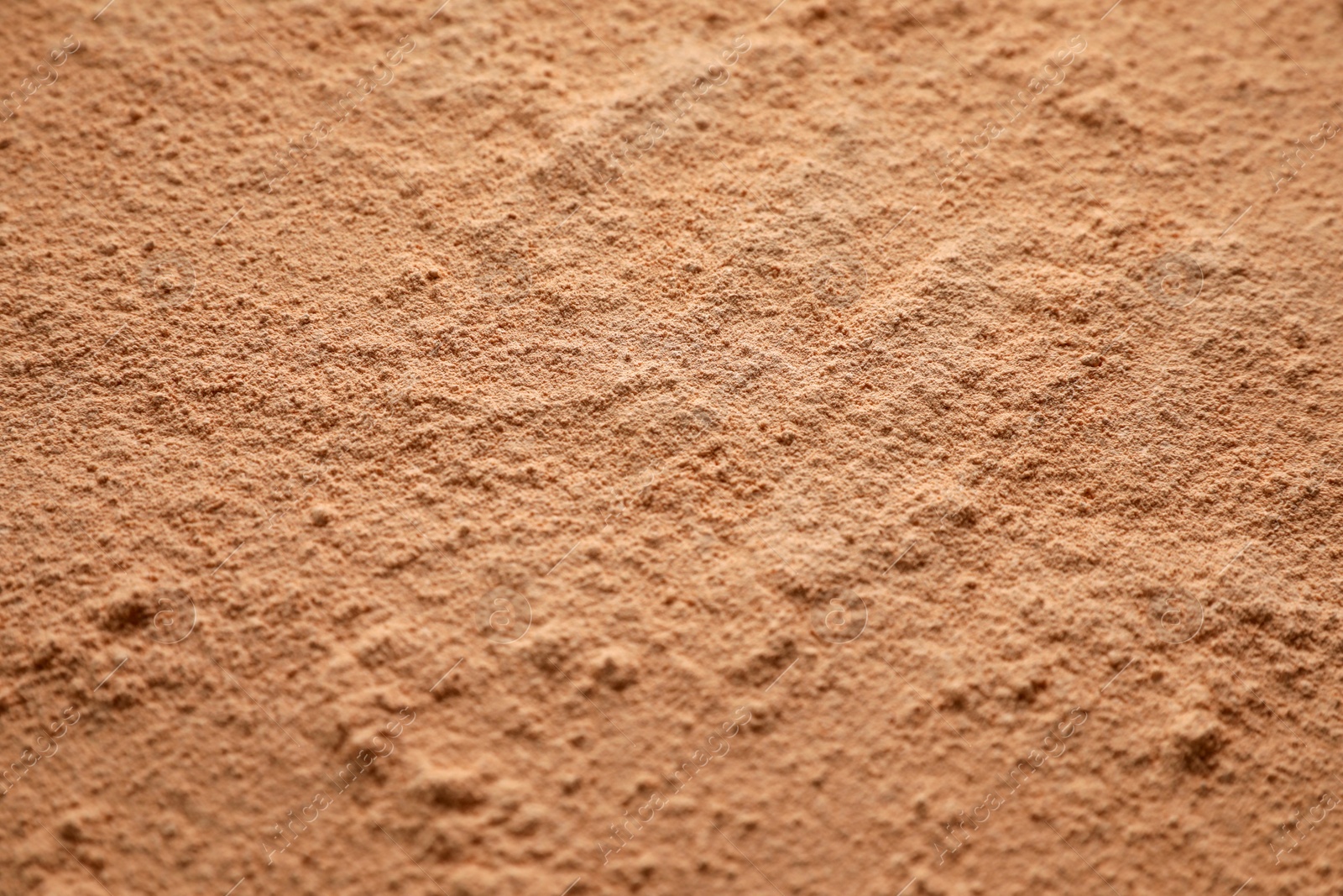 Photo of Loose face powder as background, closeup view